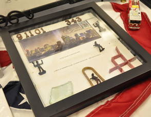 Items Thomas Cooney recovered at Ground Zero including a piece of window glass, standpipe hose clip, and fire truck grill.
