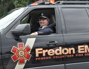 Fredon Township Mayor Carl Lazzaro drives the EMS Vehicle in the parade.