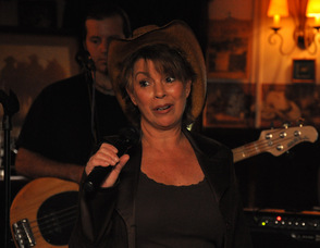 Barbara Toth, owner of the Village Saloon, thanks the crowd.