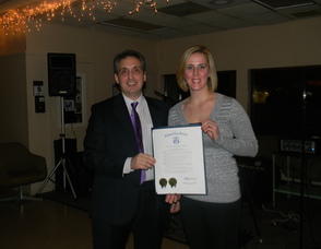 Business Owners Michelle Brugger and Jimmy Vardas with the resolution