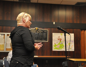 Kathy Edwards at the microphone.
