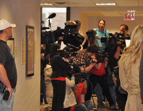 A flurry of camera people capture the crowds.