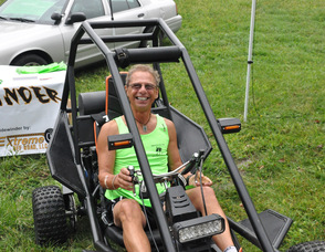 Joe Farinella sits in a Sidewinder ATV.