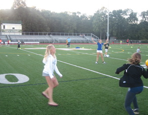 girls throwing a ball around