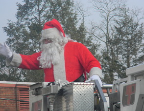 Santa arriving on the firetruck