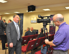 Jerry Morelli of Mugs Media filming Harold Wirths, Commissioner of the State Department of Labor and Workforce Development.