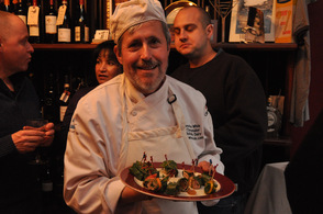 Chef/Cheesemaker Jonathan White, one of the owners and the Cheesemaker at Bobolink Dairy & Bakehouse, carries out pork shoulder wrapped in Swiss Chard.