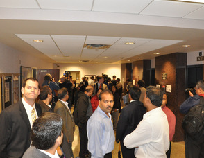 A crowd gathers outside the courtroom.