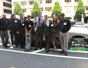Employees and guests of Extreme Energy Solutions who attended the World Green Energy Symposium stand outside of the Washington Post Building in Washington, DC.. From left to right: Phil Sermin, Dan Hollis, Shannon Smith, Mike Holler, Calvin Whitney, Samuel K. Burlum, Nermin Ucar, and Bill Pereca.  