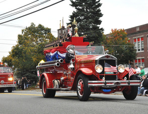 The vintage Ogdensburg fire truck carries the trophies.