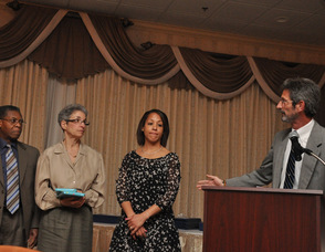 Andrew Lowery presents the Smile Award - Knight Family Scholarships to two students while family members Jackie (Class of 2002, and also 2002 recipient of the Tony Pompelio and Schoolmates Award of Courage), Janet, and Glen look on. Lowery said this year, the amount of nominees doubled, from 48 to 96.