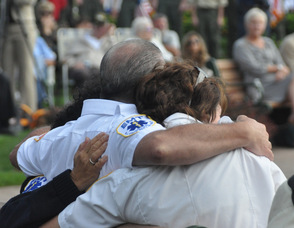 One of the moments captured by Jennifer Jean Miller on September 11, 2011 by Jennifer Jean Miller in West Orange, at a ceremony that overlooked the New York Skyline.