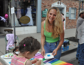 Danielle Ray of Living Waters Fellowship works on crafts with children.