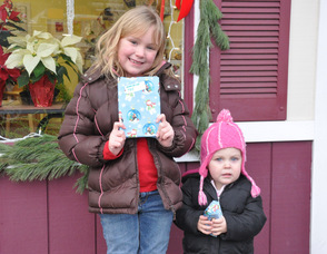 Madeline and Claire Meyler, ages 5 and 19 months,with their gifts. 