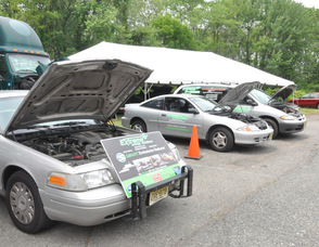 Cars equipped with the SMART Air Fuel Saver outside of Extreme Energy Solutions.