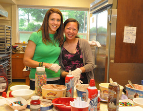Moms Denise Hayek and Janine Cordero serve up sundaes.