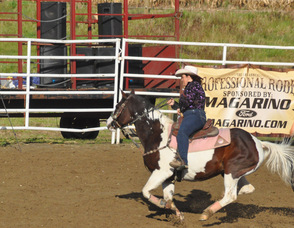 Donna Frisco rides "Taz" during barrel racing.