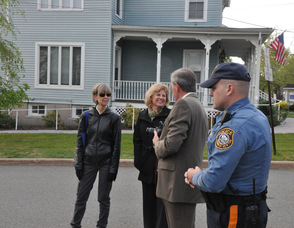 Officer Steven VanNieuwland, Joseph Caravella of TransOptions, Merriam Avenue School Principal Karen Perez, and teacher Linda Salerno of the Merriam Avenue School. 