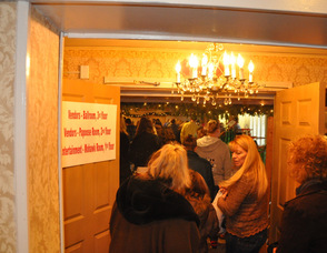 A steady stream of customers enter the Papoose Room.