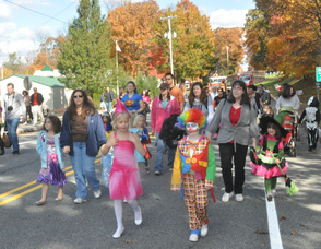 Princesses, clowns, witches, and more, walking in the parade.