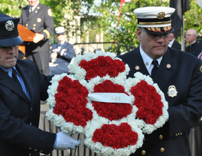 Joseph Inga, Sussex County Fire Marshal, with his son, Joseph, who works with the FDNY, carry the Fire Wreath.