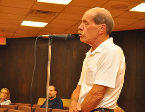 Resident Ray Storms addresses the council.