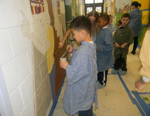 Students painting the mural