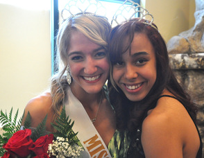 Miss Newton 2012, Ashley Iliff, hugs Miss Newton 2011, Kayla Sibblies.