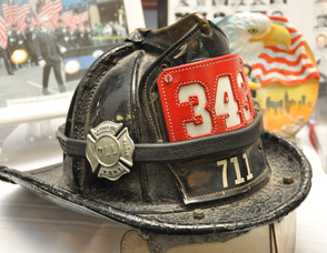 Thomas Cooney's fire helmet, which he said saved his life during his firefighting career when he was hit with debris on the head during the King riots, with a 343 placard, in memory of the New York City firefighters who died on September 11, 2001. 