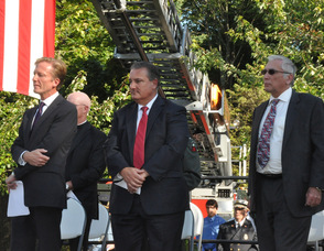 N.J. Burkett, Bob Dunphy, Dr. Paul Mazur,Pastor Brian Sullivan, and Reverend Ernest Kosa, listen to Kelly Wask sing, "God Bless America". 