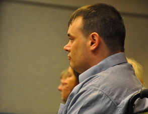 Scott Harris listens to court proceedings.