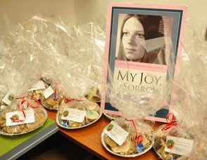 A photo of Karen Ann Quinlan is surrounded by trays of cookies in one of the offices.