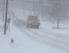 A Town of Newton DPW Truck heads up Trinity Street.