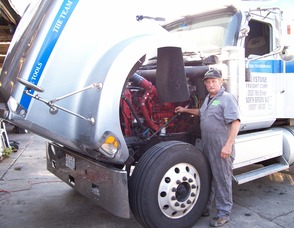 Keystone Freight, a national carrier looks for ways to become compliant.  Caption: Extreme Energy Solutions Inc. Tech Director Mark Ringen inspects arecent SMART Emissions Reducer retrofit for Keystone Freight Corp.