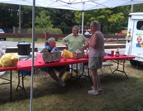 Recreation Committee Member Marie Jozowski and Stanhope Mayor Rosemarie Maio serve free hot dogs to the residents.