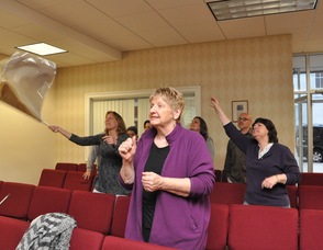 Members of the audience waving flags during worship.