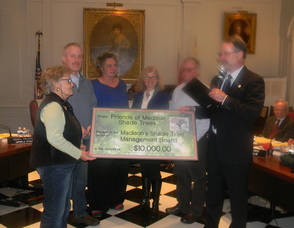 Representatives from the Madison Shade Trees Inc. doanting money to the borough