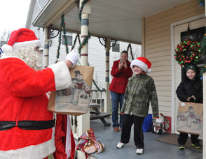 Santa visits the Teets residence, to triplets Patrick, Matthew, and Jason, age 7.