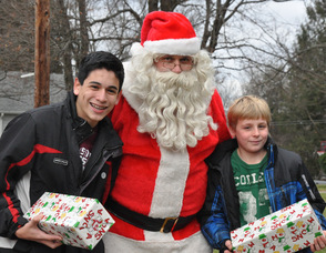 Santa poses with brothers Nick and Shane Nannery, ages 13, and 10.