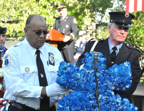 Liam Glinane of the FDNY, and Donald Stoll of the Wallkill Valley First Aid Squad carry the EMS wreath.