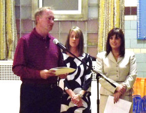 Bill Kehoe, L, presents Lefty Boland Grant Association Check to Connie Salimbeno, R