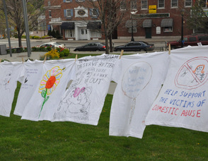 Shirts across the square reflect the demographics affected by abuse.