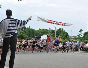 Andy Ball, race organizer, fires the starting pistol.