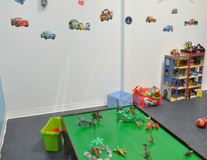 The boys' room filled with dinosaurs, blocks, trains, cars, and more, at Chuckle Time.