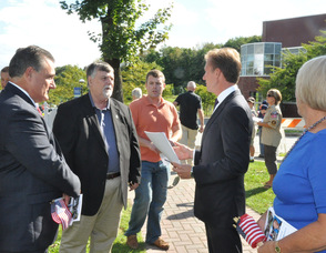 N.J. Burkett speaks with Bob Dunphy, Phillip Crabb, Dan Flynn, and Barbara Wortmann.