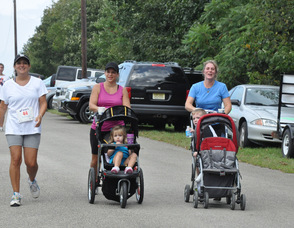 Moms and kids finish the race, including Pauline Murphy, Vicki Kowalski, and Kim Strada.