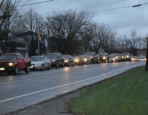 Cars wait on Halsey Road for gas at Fairclough Fuel in Hampton Township, on Tuesday evening.