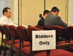 Bidders for the Sussex County Homestead sit in one of the Bidders areas.