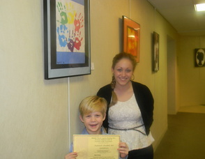 Art teacher Jaimie Bass with first grader Matthew