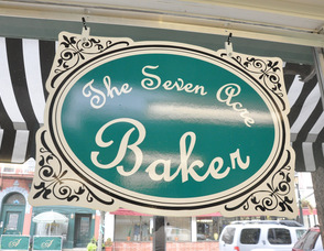 The Seven Acre Baker's sign, overlooking Spring Street.